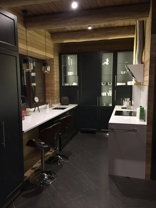 Dark kitchen with glass display cabinets