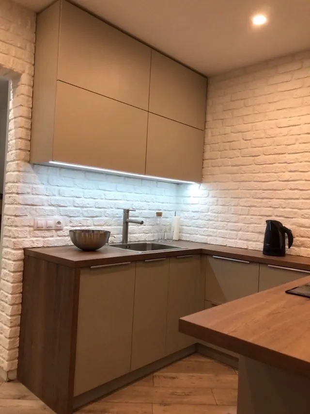 Kitchen with brick wall